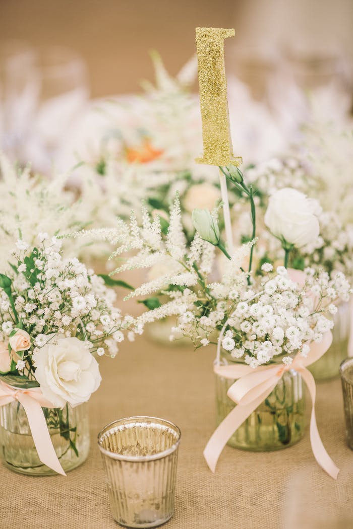 Charming floral arrangement with white roses and babys breath on a wedding table in Kowloon, Hong Kong.